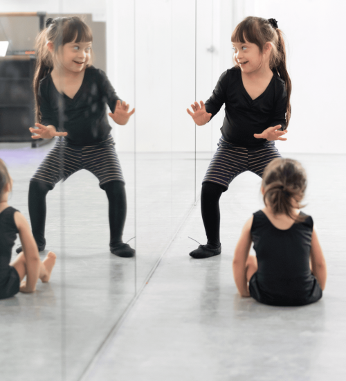 Child dancing in mirror